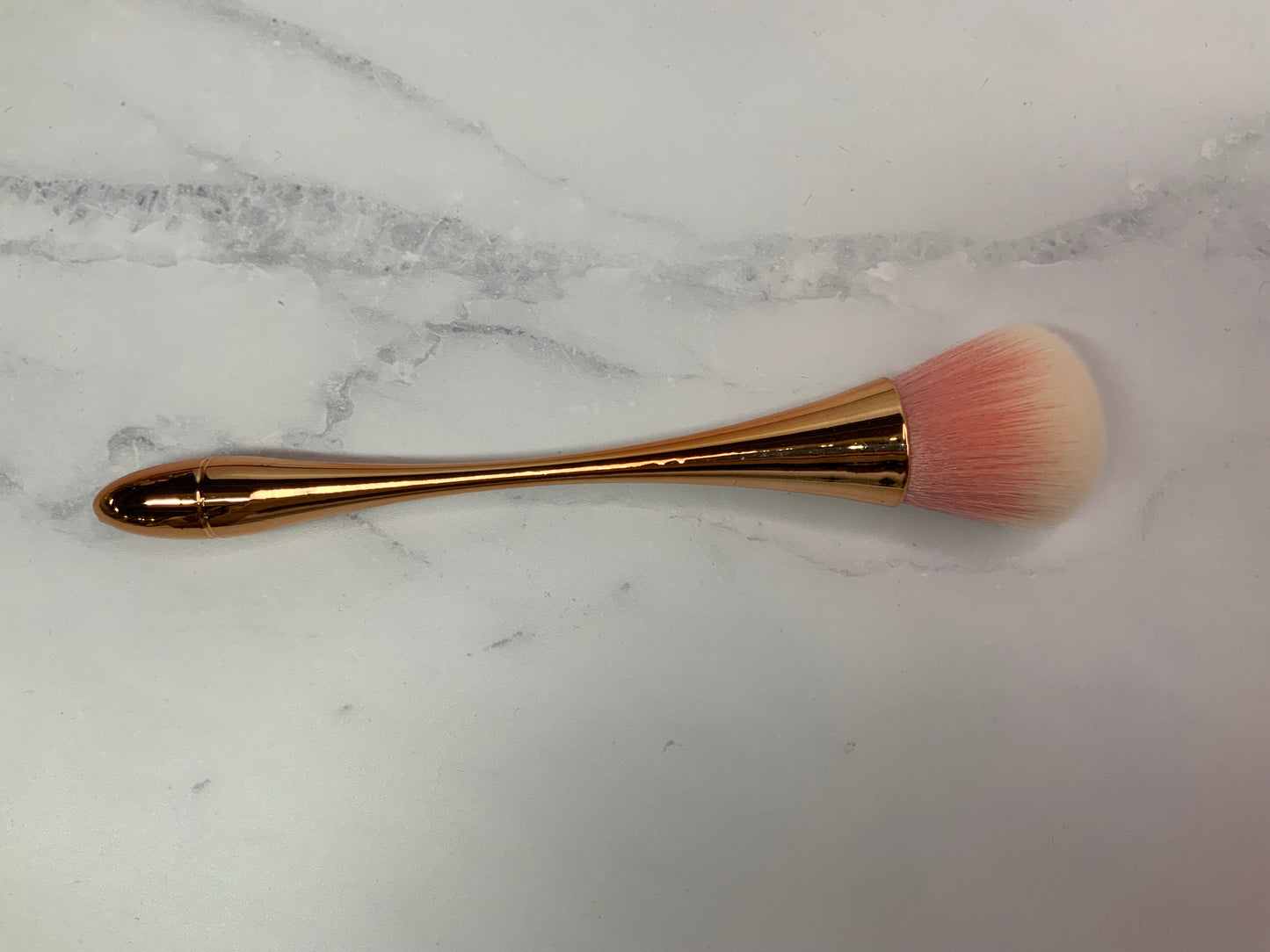 Rose gold cleaning brush