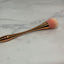 Rose gold cleaning brush