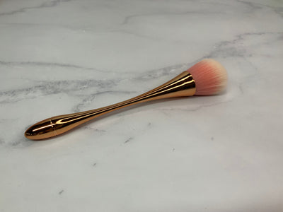 Rose gold cleaning brush